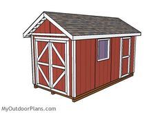 a small red shed with a brown roof