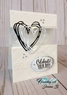 a white card with some black and white hearts on it