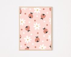 a card with ladybugs and daisies on it, against a white wall