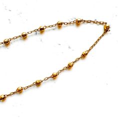 This 10K Yellow Gold Vintage Rosary Necklace is a classic and timeless piece. Crafted in 10K yellow gold and featuring 2.5mm beads, this 32" necklace is sure to bring sophistication and sophistication to any ensemble. A piece you'll love to keep for years to come. Thank you for visiting our shop!Visit our website DmKJewelry.comAlso Follow us on Instagram https://www.instagram.com/dmkjewelryny/ Classic Gold Ball Chain Necklace, Classic 14k Gold Ball Chain Necklaces, Classic Yellow Gold Beaded Chain Necklace, Classic Gold Necklaces With Satellite Chain, Classic Necklace With Satellite Chain And Round Beads, Classic Yellow Gold Jewelry With Ball Chain, Classic Gold Beaded Chain Necklace, Yellow Gold Satellite Chain Necklace With Round Beads, Yellow Gold Long Beaded Chain Necklace