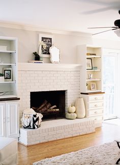 a living room filled with furniture and a fire place