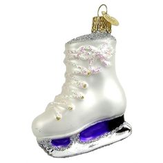 an ornament shaped like a shoe with purple and white shoes on the bottom