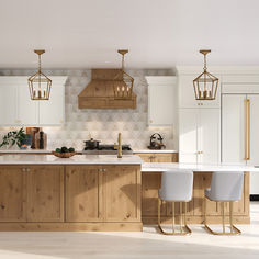 a large kitchen with wooden cabinets and white counter tops, gold pendant lights hanging from the ceiling