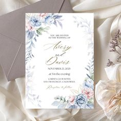 a wedding card with flowers on it