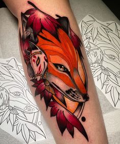 a tattoo with an image of a fox on it's leg