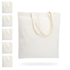 six white canvas bags with handles on each side and four tote bags in the middle