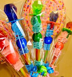 there are many colorful lollipops wrapped in cellophane and tied together