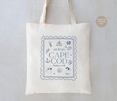 a tote bag with the words cape and god printed on it in blue ink