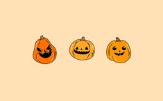 three pumpkins with faces drawn on them