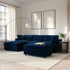 a living room with a large blue sectional couch