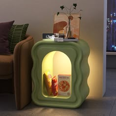 an illuminated table with food and drinks on it next to a couch in a living room