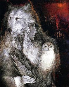 a woman holding an owl next to a wolf