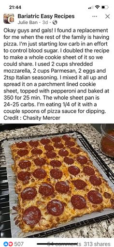 a pizza sitting on top of a pan covered in pepperoni