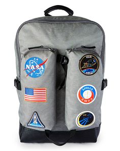 You’ll be ready for any out-of-this-world adventure when you sport this awesome NASA backpack! This officially licensed bag features six different patches embroidered on the front pockets and will have you feeling like a stylish space cadet in no time at all. Officially licensed Adjustable padded straps 2 water bottle pockets 2 outside zip pockets Outside Laptop pocket Zip-around and clip closure Material: Polyester Care: Spot clean Imported Casual Embroidered Backpack, School Backpack With Logo Patch, Backpack With Logo Patch For Outdoor Activities, Casual School Backpack With Logo Patch, Outdoor Activities Backpack With Logo Patch, Back To School Travel Bags With Logo Patch, Sporty Backpack With Logo Patch, School Backpack With Embroidered Patch, Embroidered Patch Backpack For Everyday Use