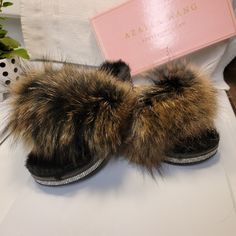 Ladies' Genuine Fur Slippers, Characterized By Their Plush Texture And Regal Appearance. These Slippers Feature A Black, Pliable Sole That Comfortably Accommodates Feet Sized 6 To 7, Making Them Suitable For Individuals With Small To Medium-Sized Feet. Additionally, I Have Similar Slippers In A Vibrant Multi-Colored Pink And Blue Combination, As Well As A Striking Neon Green Pair Adorned With Sparkling Embellishments Around The Edges. Synthetic Slippers With Faux Fur Lining And Round Toe, Winter Sandals With Faux Fur Lining And Round Toe, Brown Synthetic Slippers With Flat Heel, Brown Synthetic Flat Heel Slippers, Brown Synthetic Flat Slippers, House Shoes Slippers, Blue Combination, Asos Shoes, Satin Shoes