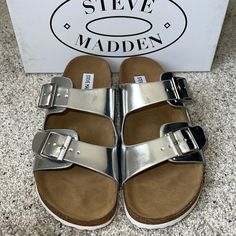 Authentic New In Box, Steve Madden Juniee Two Buckle Sandal Silver Foil With Adjustable Straps And A Magical Cork Footbed That Conforms To The Shape Of Your Foot, A Truly Custom Fit Is As Effortless As The Classic Design. Silver Foil Pu Upper Lightweight Sole Silver Footbed Sandals With Round Toe For Summer, Silver Footbed Sandals For Summer, Silver Footbed Sandals For Spring, Silver Open Toe Footbed Sandals For Summer, Silver Open Toe Footbed Sandals For Spring, Steve Madden Mules, Madden Girl Sandals, Tan Wedge Sandals, Strappy Block Heels