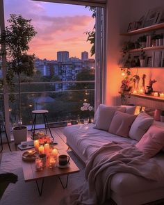 a living room filled with lots of furniture next to a large window covered in candles