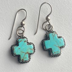 Vintage Sterling Silver Iconic Joan Slifka Hallmarked Cross Earrings With Genuine Turquoise And Hooks For Pierced Ears. Was Planning To Add The Crosses To Some Hoops But Haven’t Gotten Around To It. These Cute Little Charms Can Be Added To Another Slifka Necklace. Some Of Her Charms Were Sold Separately And Can Be Hunted Down To Make Another One Of A Kind Custom Piece. Taking Offers In Used Condition With Patina And Darkening Of Silver Hoops May Be Misshapen See Photos For Condition And Description Elegant Turquoise Cross Jewelry, Adjustable Turquoise Cross Jewelry, Turquoise Cross Sterling Silver Necklace, Turquoise Sterling Silver Cross Pendant Jewelry, Southwestern Turquoise Nickel-free Hoop Earrings, Turquoise Cross, Cross Earrings, Genuine Turquoise, Silver Hoops