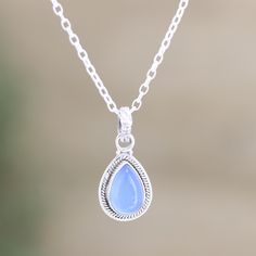 Gaze into the cloudy blue stone on Bhavya Jain's pendant necklace and feel the calming properties of chalcedony. Indian artisans use sterling silver to hand craft the necklace, centering the pendant with a drop of smooth chalcedony in a bezel setting. Halo Effect, Hand Craft, Sterling Silver Necklace Pendants, Blue Stone, Sterling Silver Pendant, Bezel Setting, Cable Chain, Spring Rings, Sterling Silver Pendants