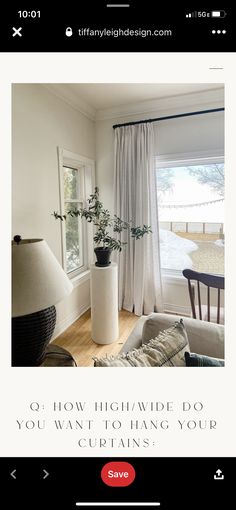 an image of a living room with white curtains and plants on the window sill