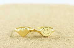 "\"Smile , it's contagious ! Let's pass it on :) \" *Good vibes Only ! These smiley signet rings are hand carved in wax and cast in silver with the lost wax technique . A perfect and timeless reminder for you or your loved ones . *Available in Sterling Silver ,Gold Vermeil ,Rose Gold Vermeil and in SOLID YELLOW GOLD 9K . * SHINY or MATTE finish . *Need it fast ? You can upgrade shipping with FedEx here : https://www.etsy.com/listing/966774899/fedex-tnt-express-shipping-delivery?ref=shop_home_act Smiley Face Ring As Gift, Fun Handmade Rings As Gifts, Fun Handmade Rings For Gifts, Handmade Fun Rings As Gifts, Black Tourmaline Ring, Amazonite Ring, Face Ring, Chic Rings, Signet Rings