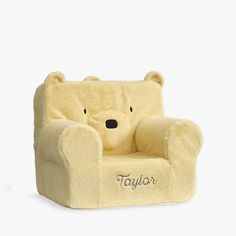 a teddy bear chair with the name taylor on it