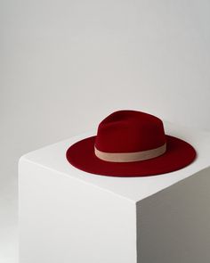 The JIGGY ROSSO offers a bold look with a classic twist. This unisex hat is crafted from 100% mulesing-free wool, featuring a thin light-grey colored ribbon in Italian suede attached by a gold-plated rivet. The size can be adjusted with a black cotton cord placed inside the crown. Its deep red color and retro-funk design will add a radical touch to any outfit. Funk Design, Crown Heights, Deep Red Color, Cotton Cord, Hat Sizes, The Crown, Deep Red, Black Cotton, Red Color