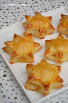 small pastries are arranged on a white plate