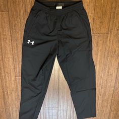 Brand New Under Armour Sweatpants Size Medium, Black Zipper At Bottom Of Legs Never Worn Mens Underarmour Sweatpants, Casual Under Armour Bottoms With Elastic Waistband, Casual Under Armour Pants, Under Armour Bottoms With Pockets, Under Armour Bottoms With Pockets For Streetwear, Under Armour Streetwear Bottoms With Pockets, Under Armour Casual Streetwear Pants, Black Casual Under Armour Sweatpants, Under Armour Black Sweatpants With Pockets