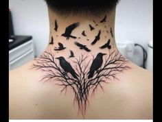 the back of a woman's neck with birds on it