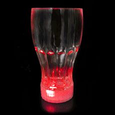 a red and black glass on a black background