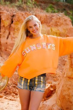 Brighten up your wardrobe with our SUNSETS ORANGE PULLOVER! This playful, oversized pullover features pink and yellow striped terry Sunsets letters on a cropped orange design. Stay comfy and stylish all day long. Orange Preppy Sweater, Sunsets Orange, Orange Pullover, Orange Design, Oversized Pullover, Pink And Yellow, Yellow Stripes, Spring 2024, Orange