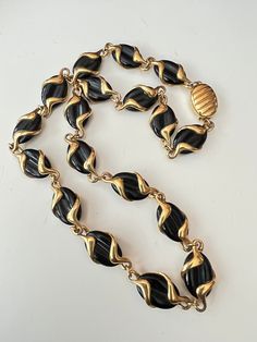 "Gorgeous vintage black enamel and gold plated necklace signed with the SWAN Logo which is SWAROVSKI. The necklace measures 18\" long Beautiful black glass oval links  with an overlay of gold plated metal in a sleek caged design.  The gold plate wraps around each link perfectly. This is a gorgeous necklace to wear or add to any vintage jewelry collection." Swan Logo, Logo Black, Gold Enamel, Gold Plated Necklace, Gorgeous Necklaces, Black Enamel, Black Glass, Chain Styles, Vintage Black