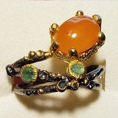 Very Unique Artistic Ring! Natural Carnelian And Emerald In Sterling Silver, Stamped 925. Black Rhodium Plated With 14k Gold Overlay Accents For Contrast And Highlighting The Stones. Please Check Out My Other Jewelry Listings And More Goodies. Thank You ! No Poshmark Account Yet? Use Invite/Referral Code Makeanoffernow And Get 10$ Posh Credit When You Join Poshmark, Good Toward Any Purchase Sitewide. Weird Rings Unique, Natural Stone Wedding Rings, Weird Rings, Funky Rings, Orange Jewelry, Old Rings, Gold Overlay, Funky Jewelry, Mens Ring