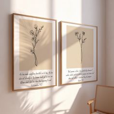 two framed art pieces hanging on the wall next to a chair and window with sunlight coming in