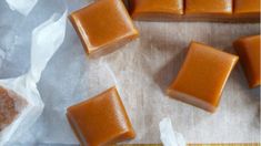 four pieces of caramel soap sitting on top of wax paper next to each other