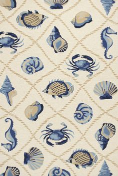 a blue and white rug with sea animals on it