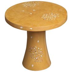 a small wooden table with white flowers on the top and bottom, against a white background