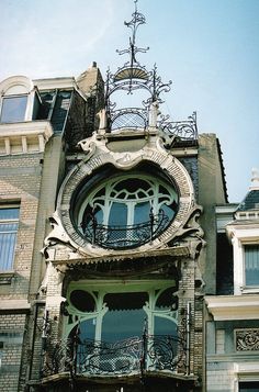 an old building with a clock on the front