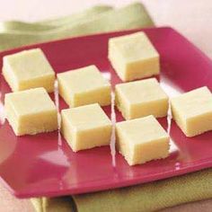 several squares of cake sitting on a red plate