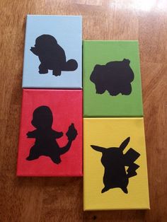 four different colored blocks with silhouettes of animals on them