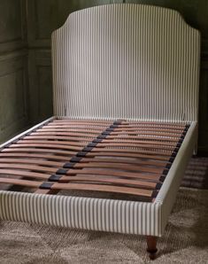 the bed is made and ready to be used for someone's bedroom or office