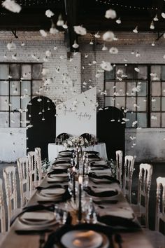 the table is set with black and white linens