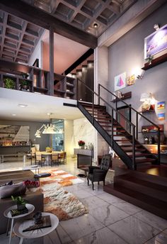 a living room filled with furniture and a stair case