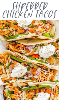 three shredded chicken tacos with sour cream on top