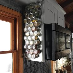 a kitchen area with a stove, microwave and oven in the wall next to a window