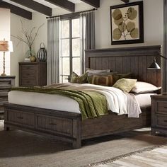 a bed sitting in a bedroom next to a dresser with drawers on top of it