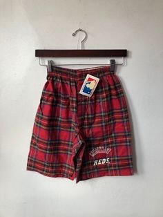 "90s reds plaid twill cotton boxers. deadstock. NWT. red plaid. white screen printed logo. snap fly. in excellent, unworn condition. made in USA. 11\" waist (laid flat, unstretched). 12.5\" rise. 8\" inseam. #27 jose rjjo. legit. legitvintage.etsy.com legitvintage on instagram" Trendy Red Relaxed Fit Shorts, Red Lounge Shorts, Retro Red Shorts, Retro Red Beach Shorts, Red Plaid Shorts, Windbreaker Jacket Mens, Lounge Shorts, Classic Sneakers, Cincinnati Reds