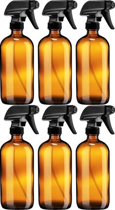 six brown glass bottles with black sprayers