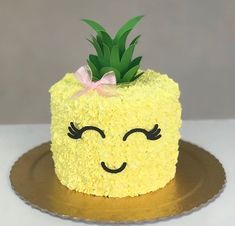 a yellow cake with a pineapple on top